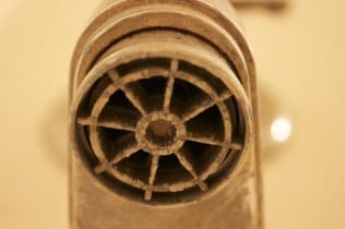 mineral buildup on sink and shower heads
